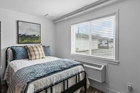Pasco apartment for rent - a small bedroom with a bed and a window